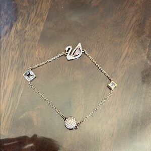 Swarovski Elegant Gold and Silver Swan Bracelet